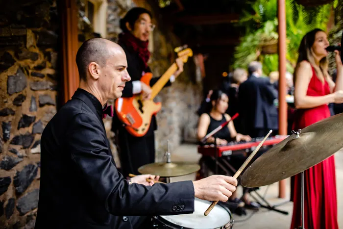 Live jazz combo playing during a wedding cocktail hour